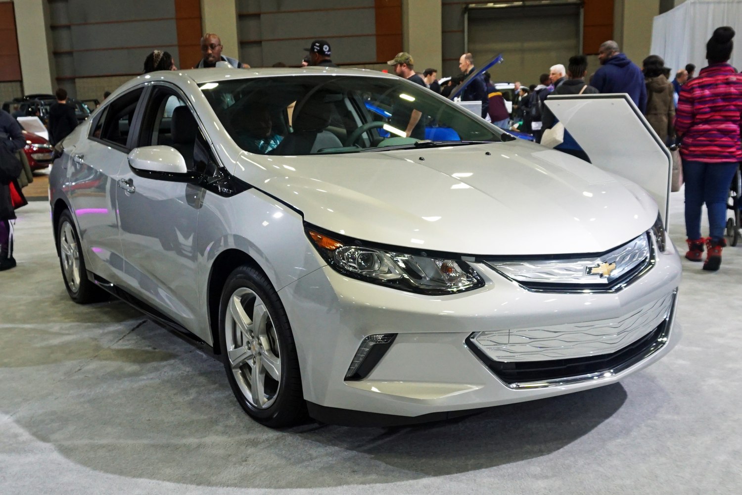 Front and side view with headlights of a compact sedan