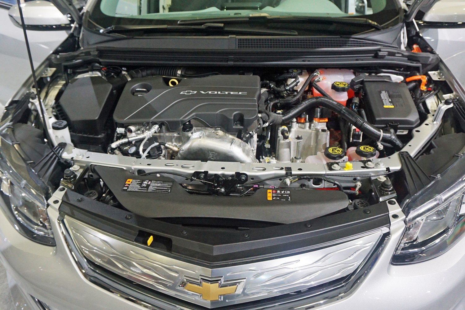 Close-up view of hybrid powertrain engine bay with Voltec branding