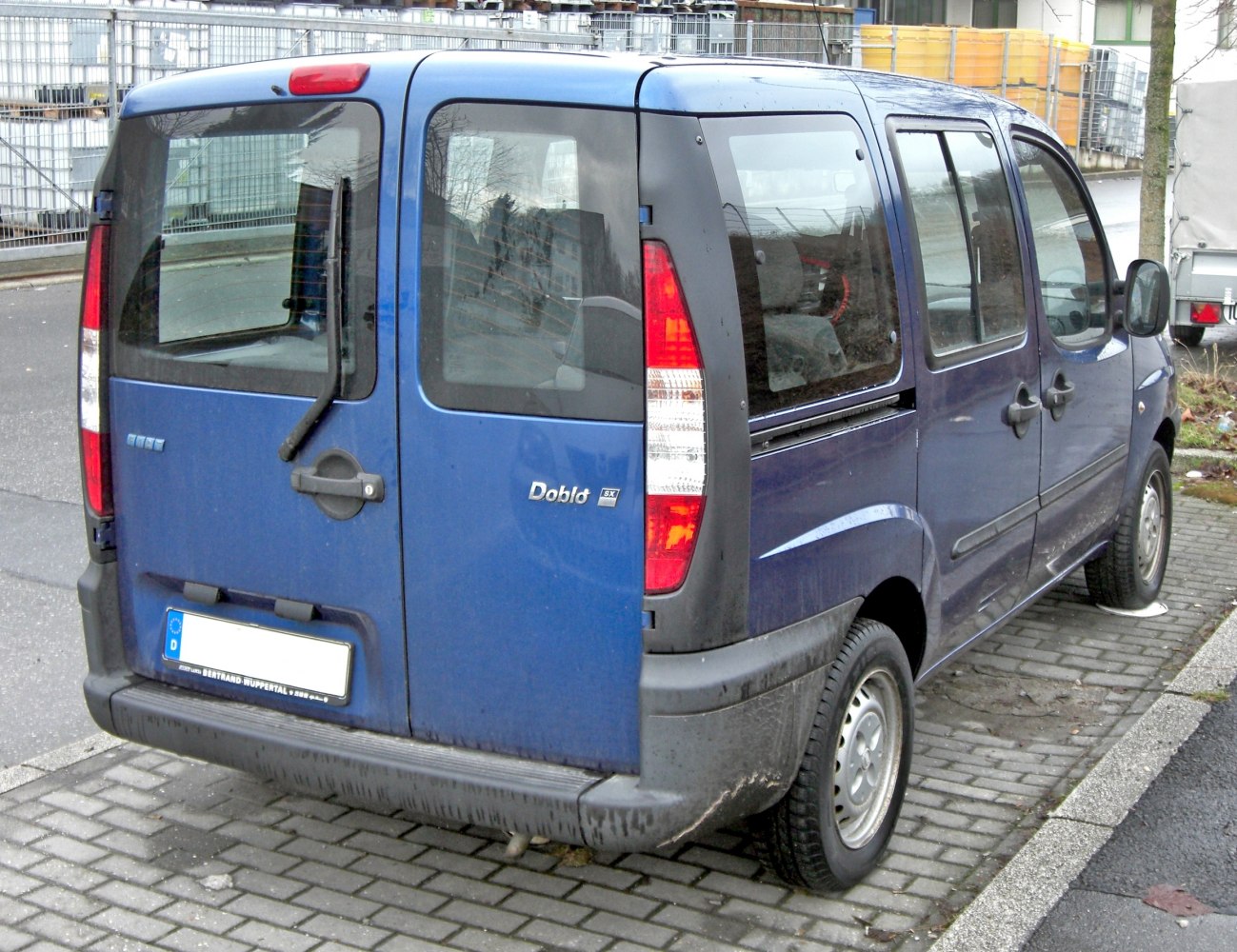 Rear view showing dual rear doors and vertical taillights on a van.