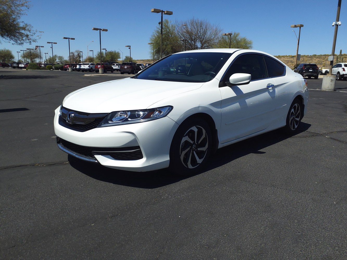 Aerodynamic front and side view with modern headlights and alloy wheels