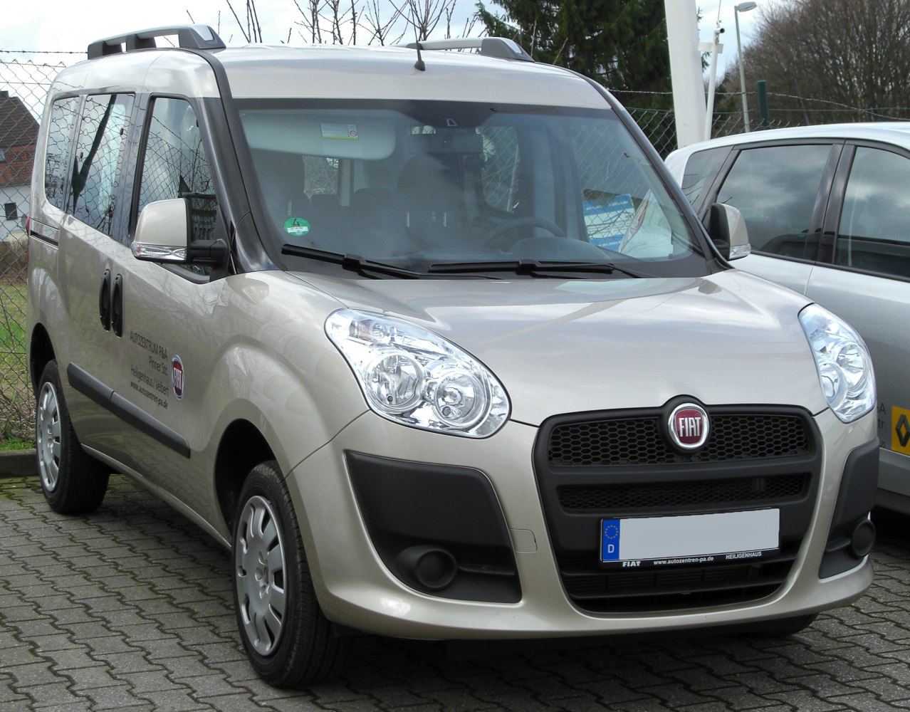 Front angled view with distinctive rounded headlights and black grille