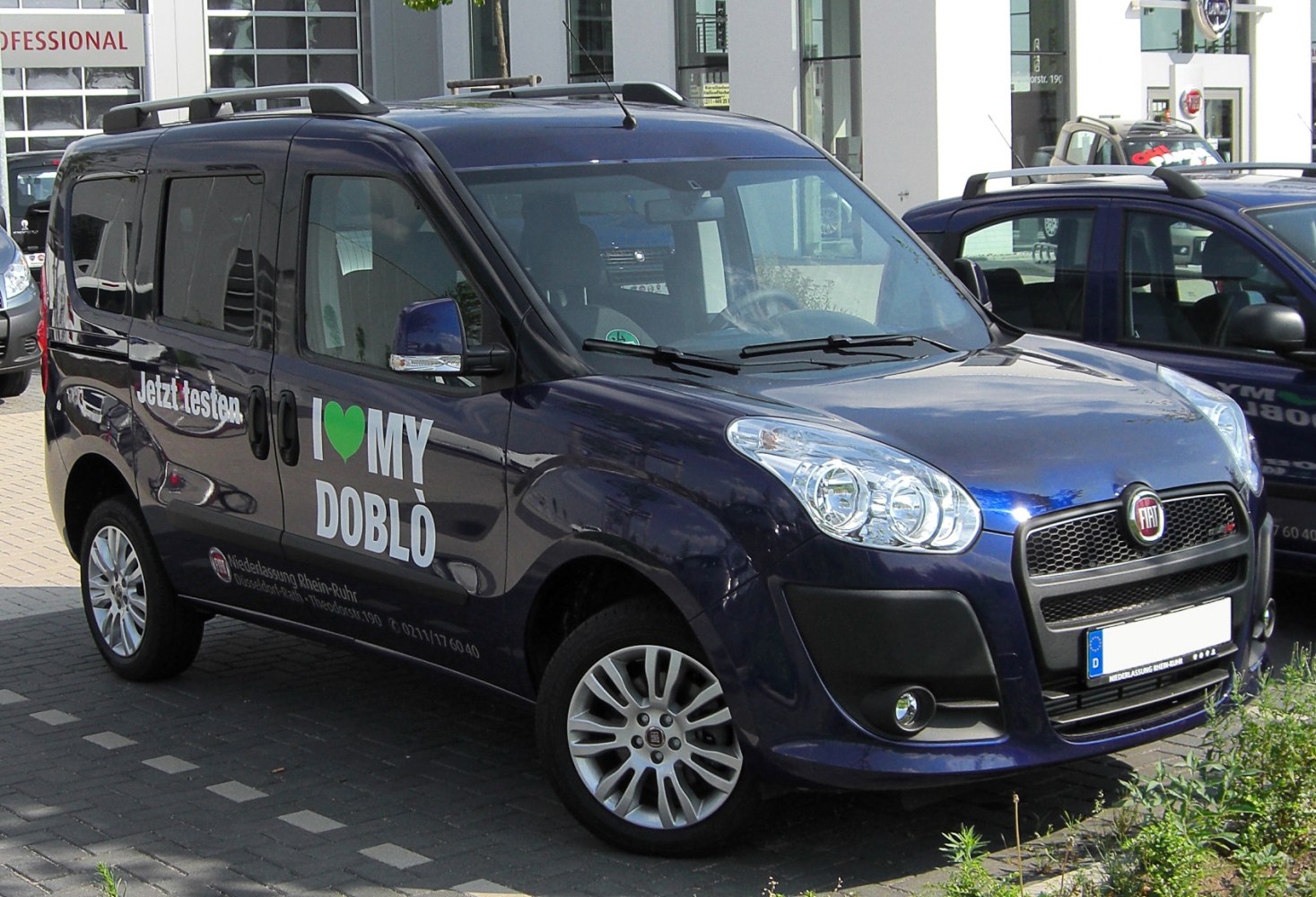 Multi-purpose vehicle front and side view with distinctive headlights