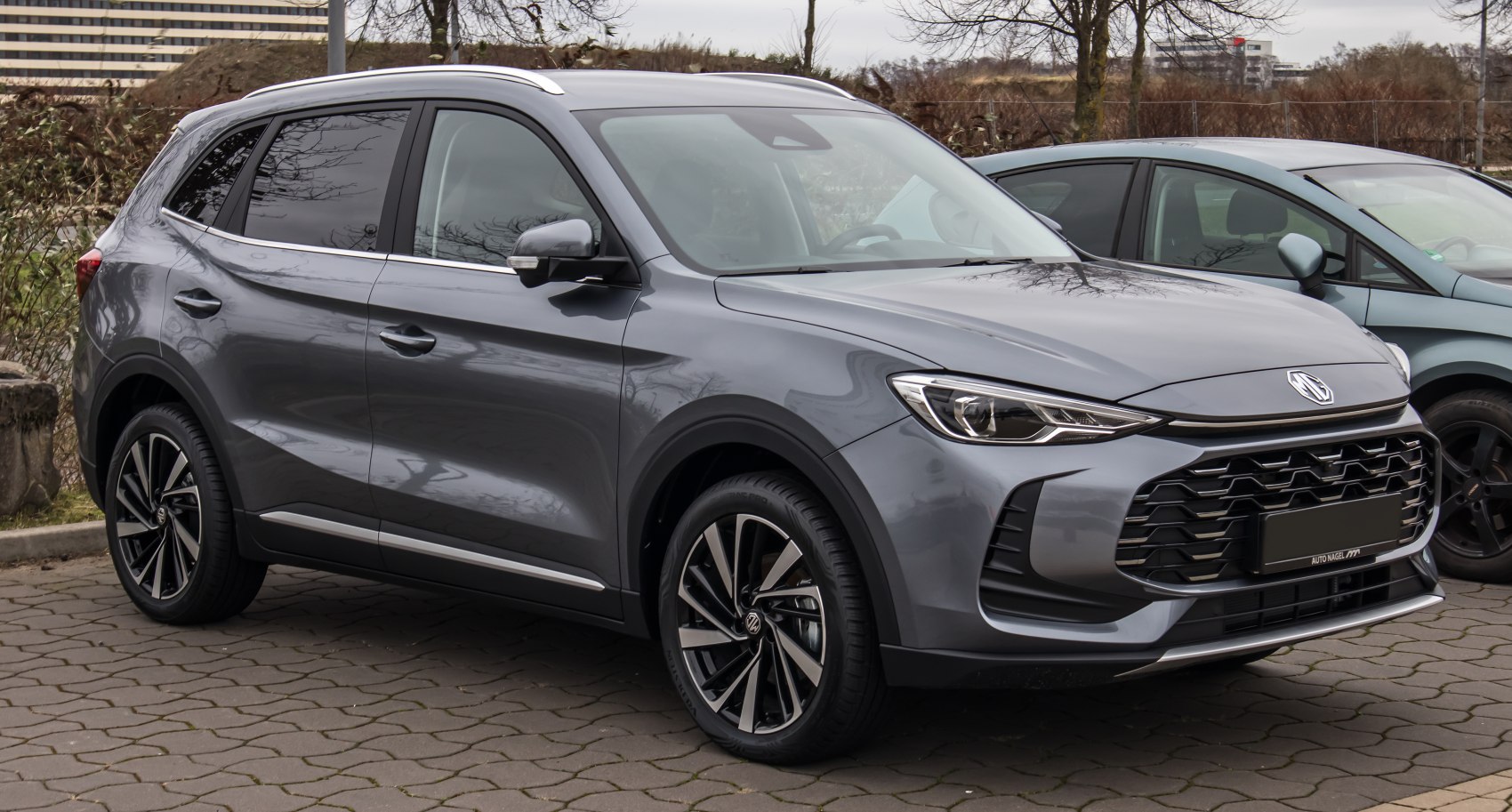 Front side view featuring LED headlights and alloy wheels in grey