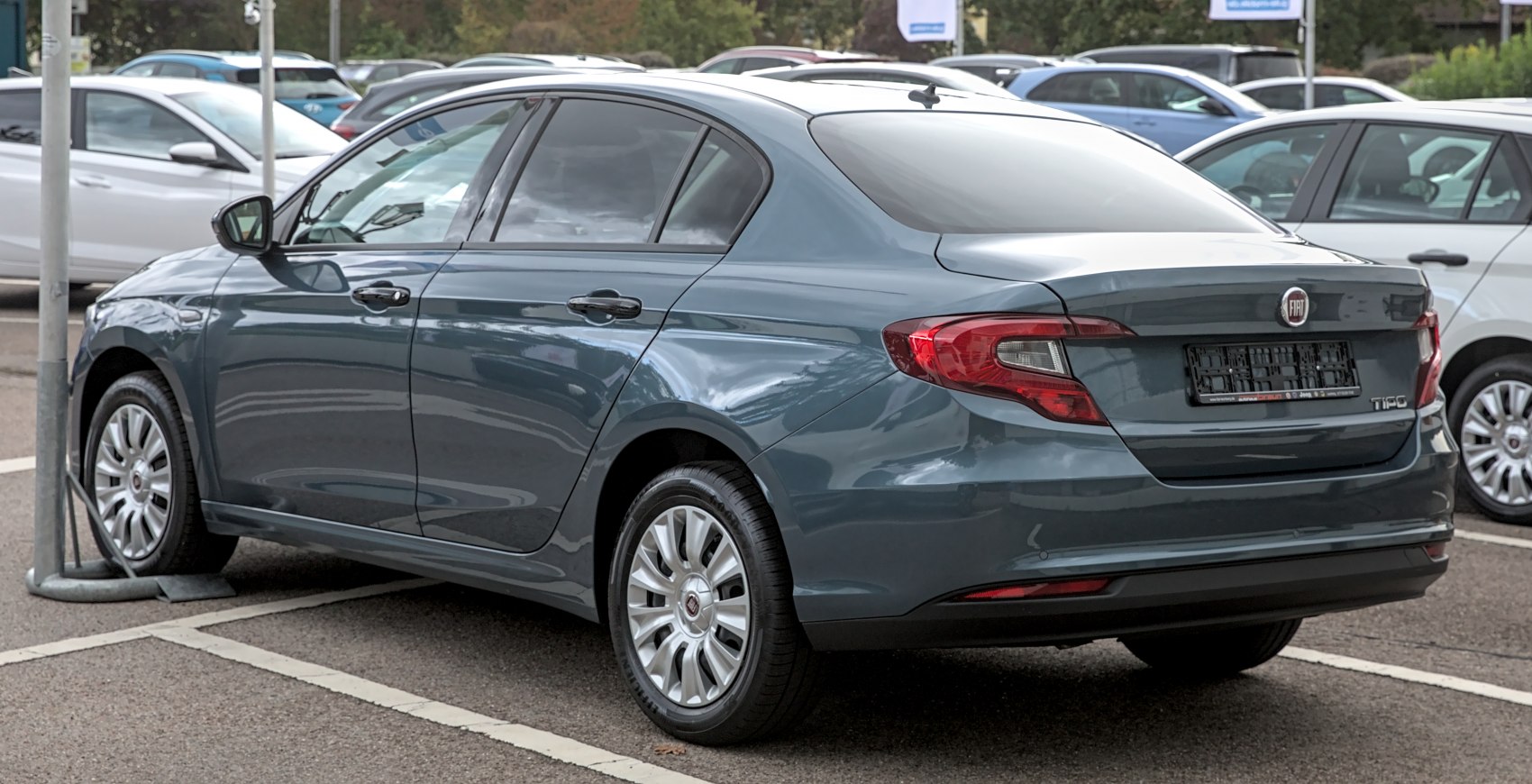Rear side view of a sleek sedan with distinctive tail lights and clean body lines