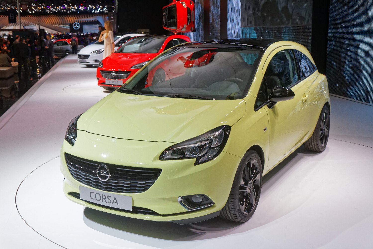 Front view of a 3-door hatchback with sporty headlights and alloy wheels