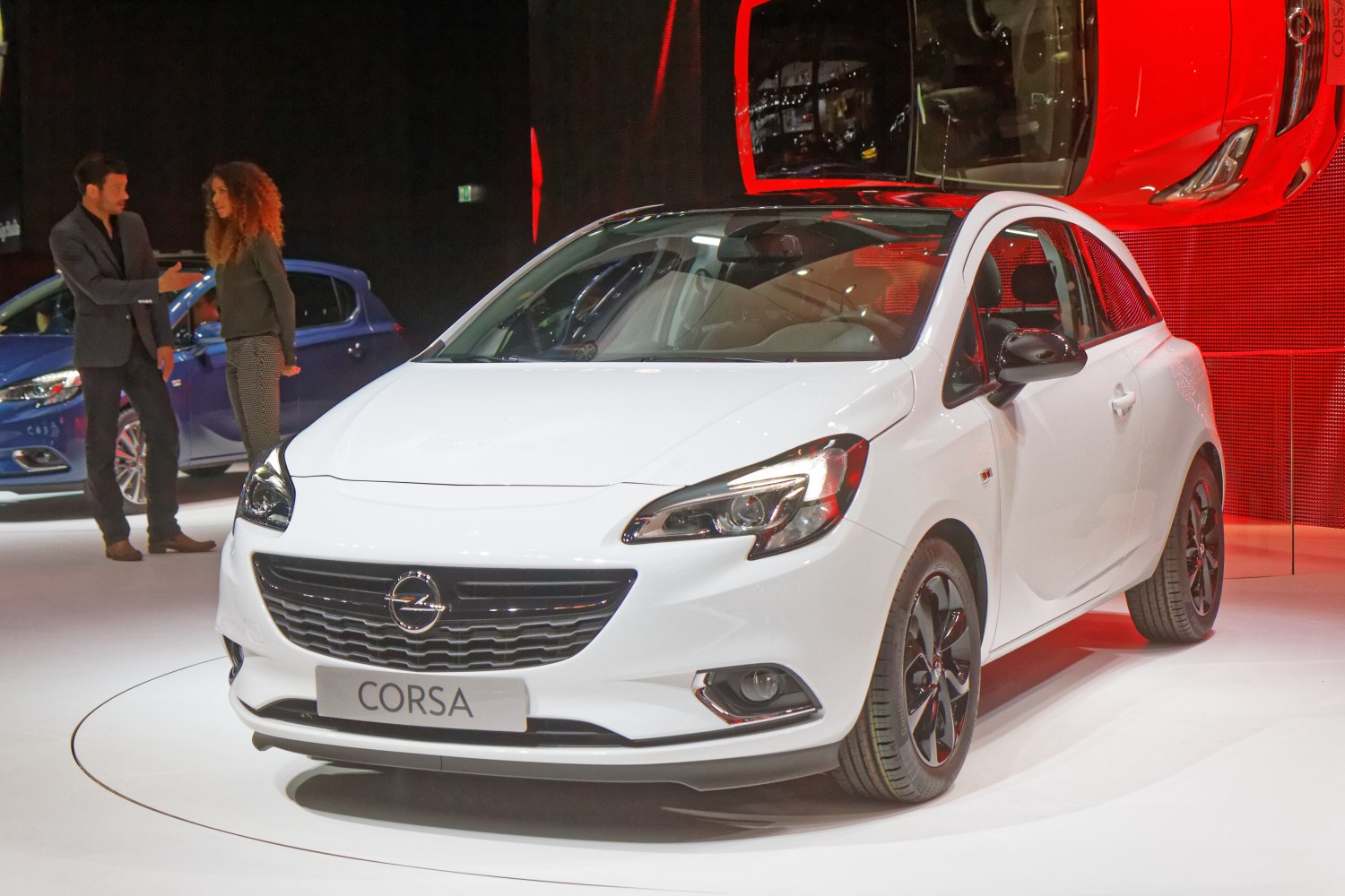 White 3-door hatchback with sleek headlights and sporty alloy wheels
