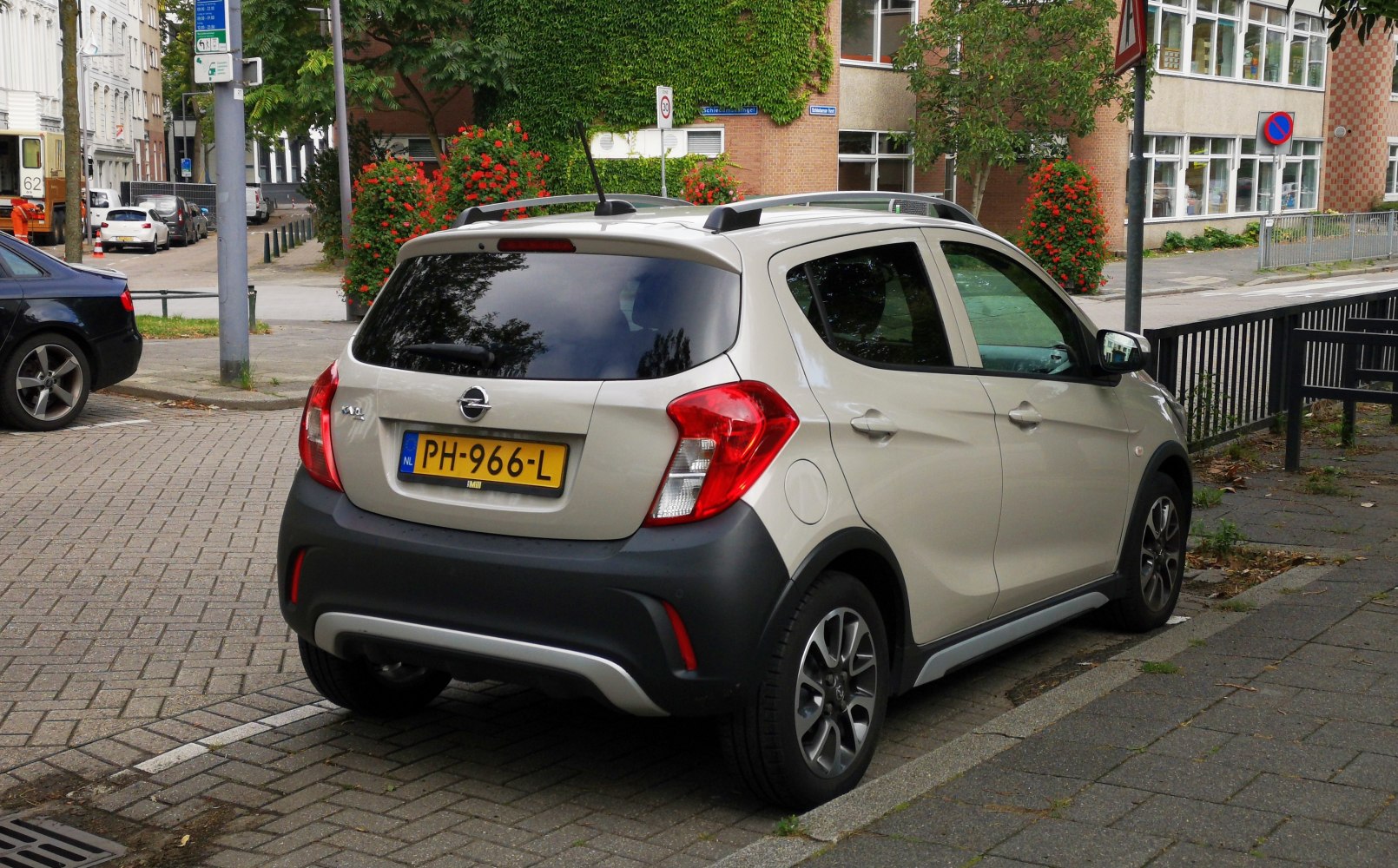 Rear and side view of compact hatchback with roof rails and alloy wheels