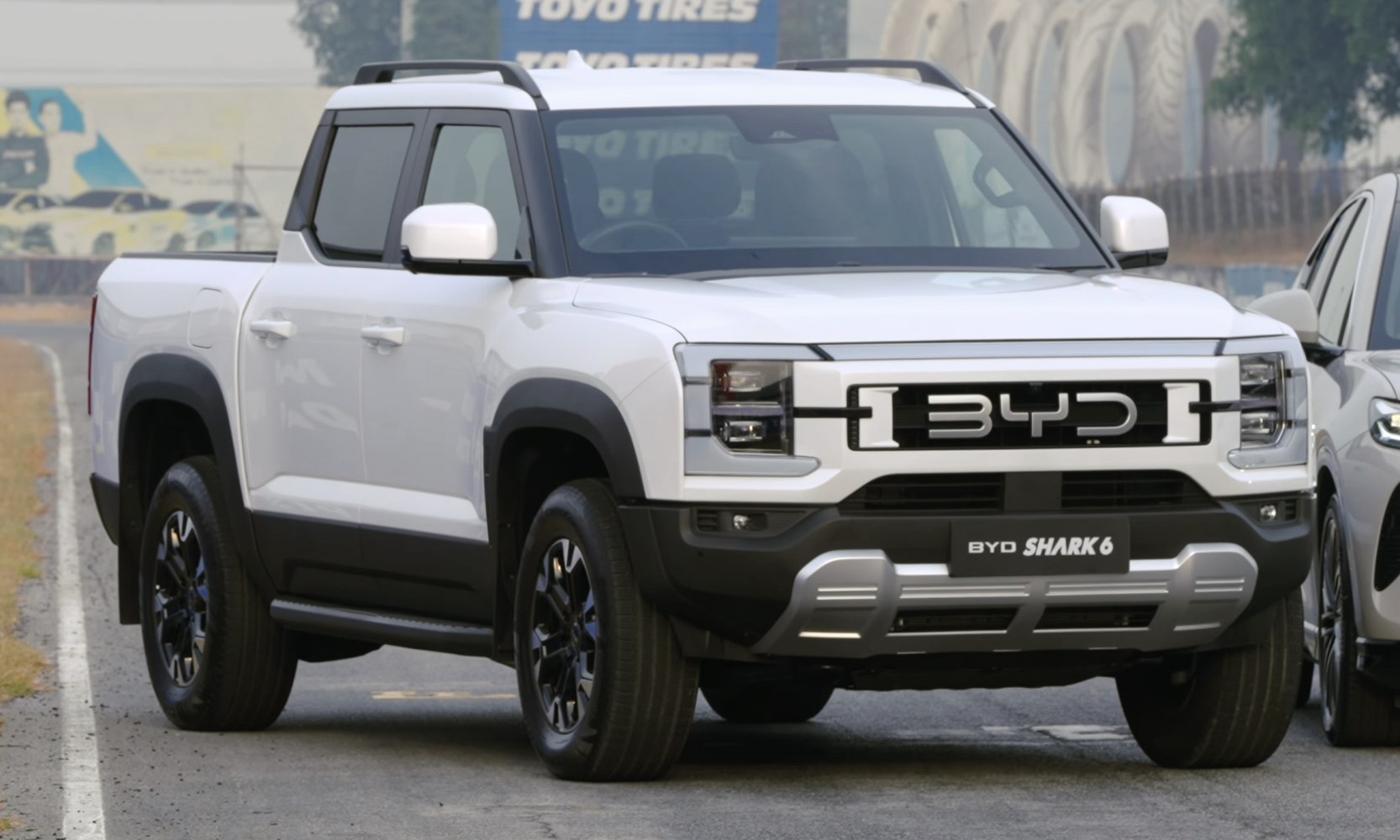 Pickup truck front with bold grille and square LED headlamps