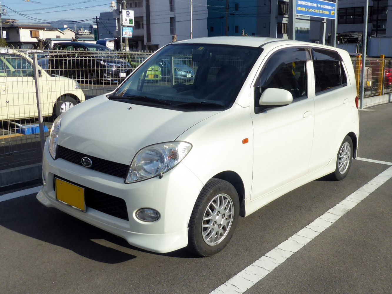 Compact white hatchback with distinctive front and alloy wheels