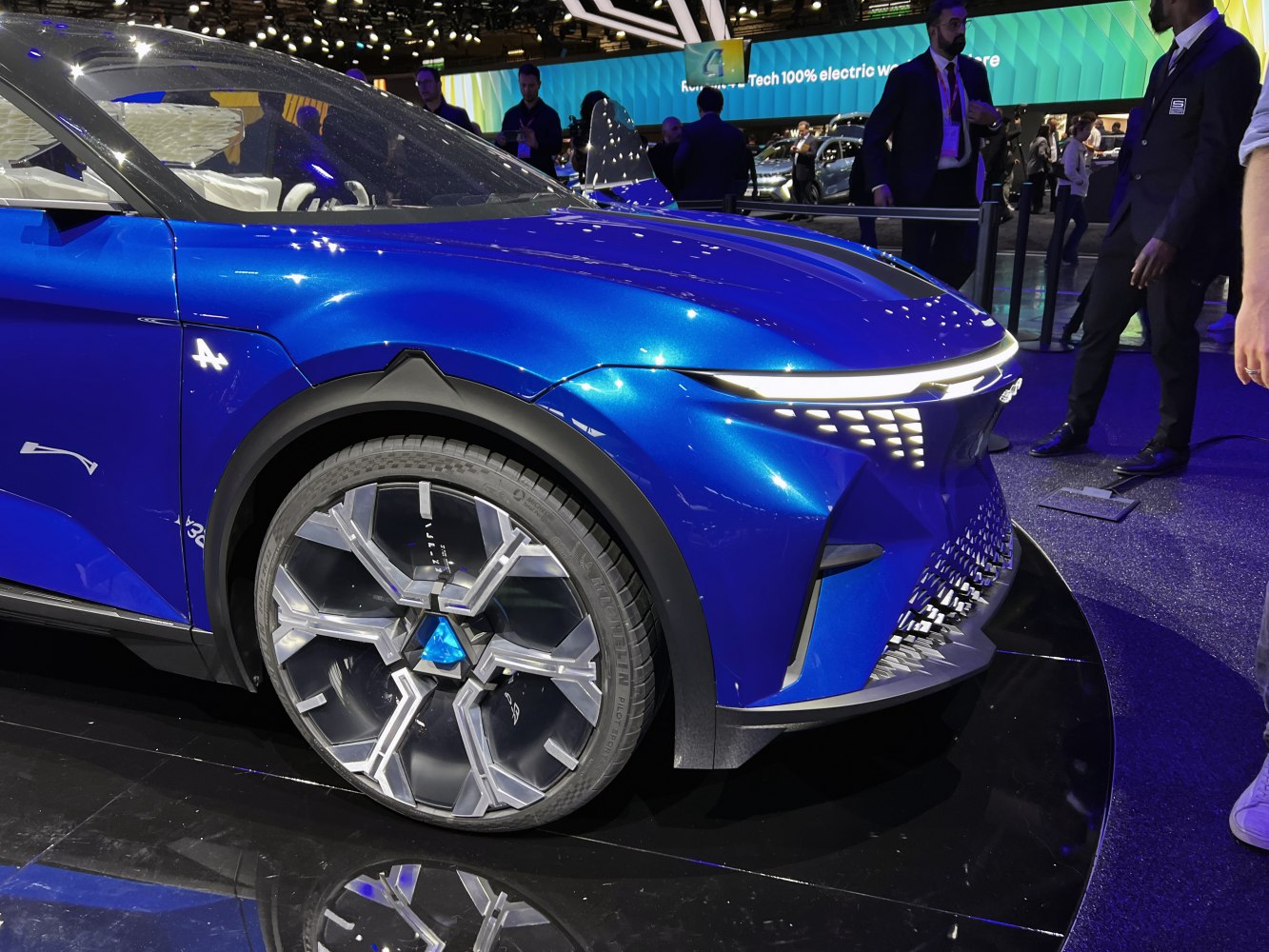 Futuristic front LED lights and distinctive wheel design of a 2024 concept SUV