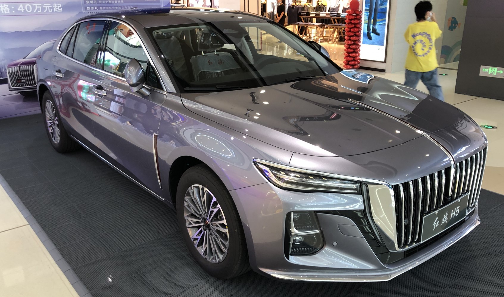 Bold vertical front grille and sleek LED headlights on luxury sedan