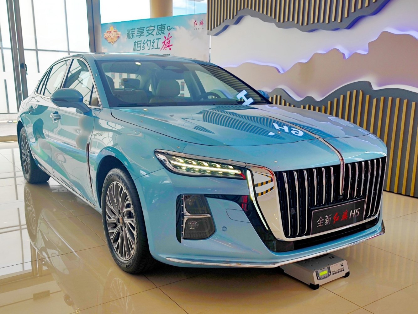 Vertical chrome grille with multi-LED headlights on sedan front