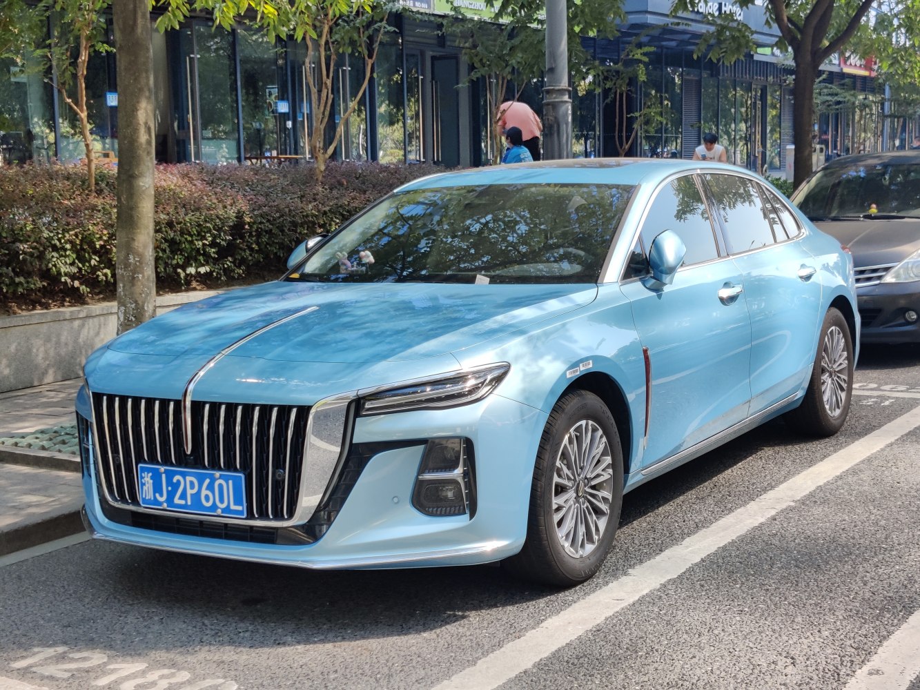 Sleek large sedan with vertical grille and LED headlights