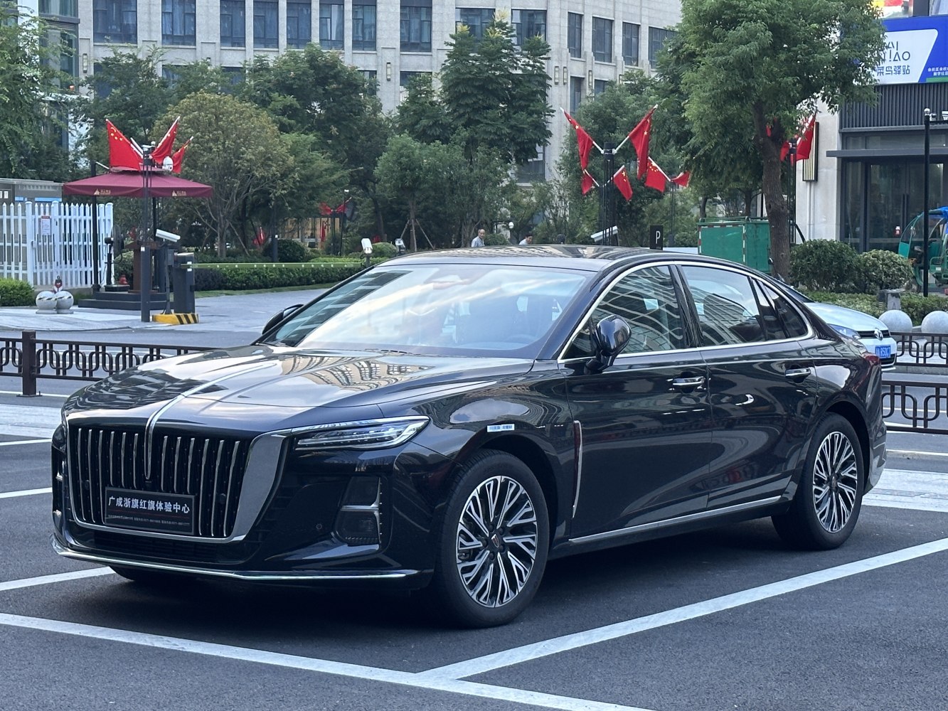 Luxury sedan with prominent front grille and intricate alloy wheels