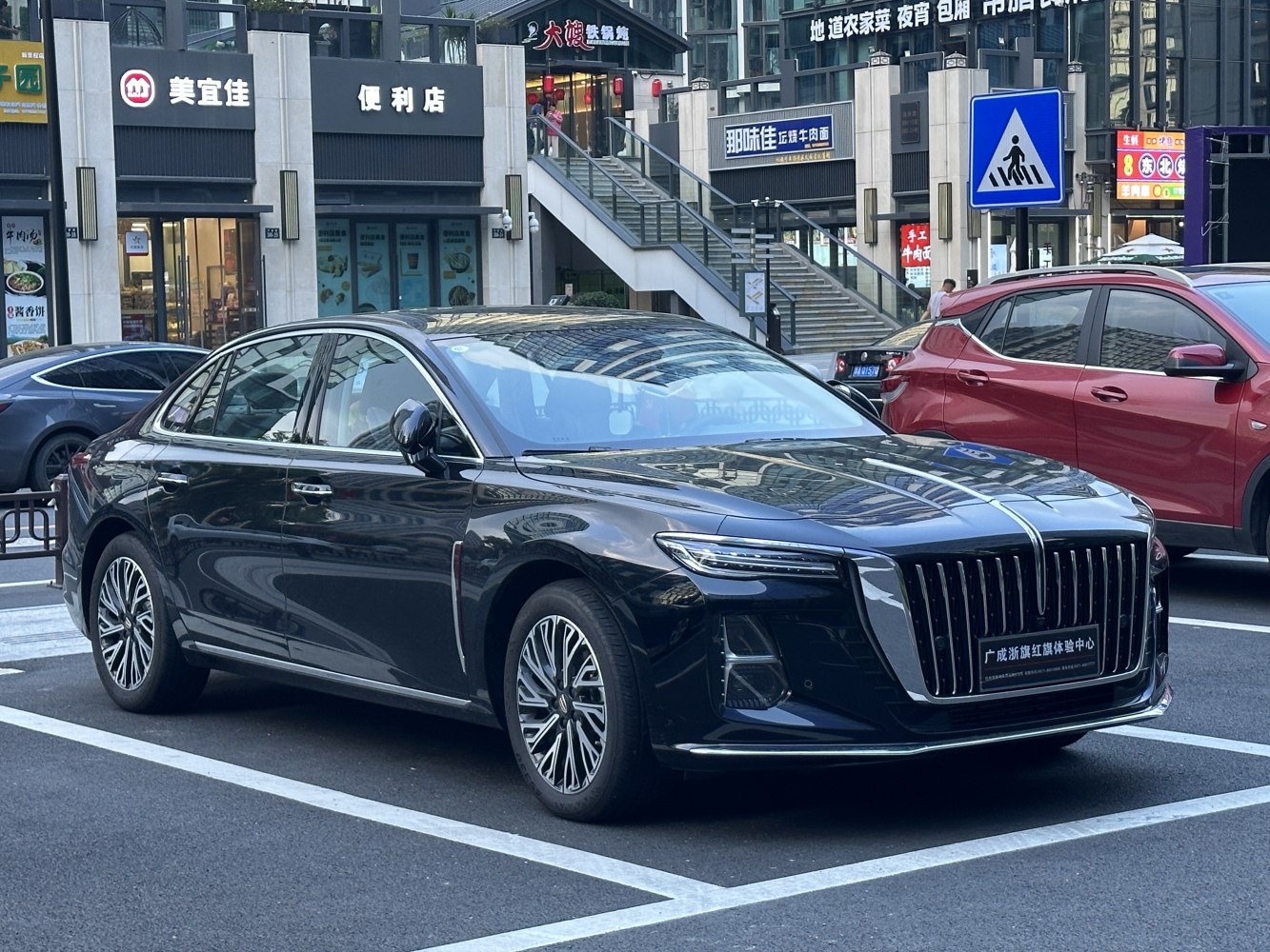 Luxury sedan with vertical grille and slim LED headlights