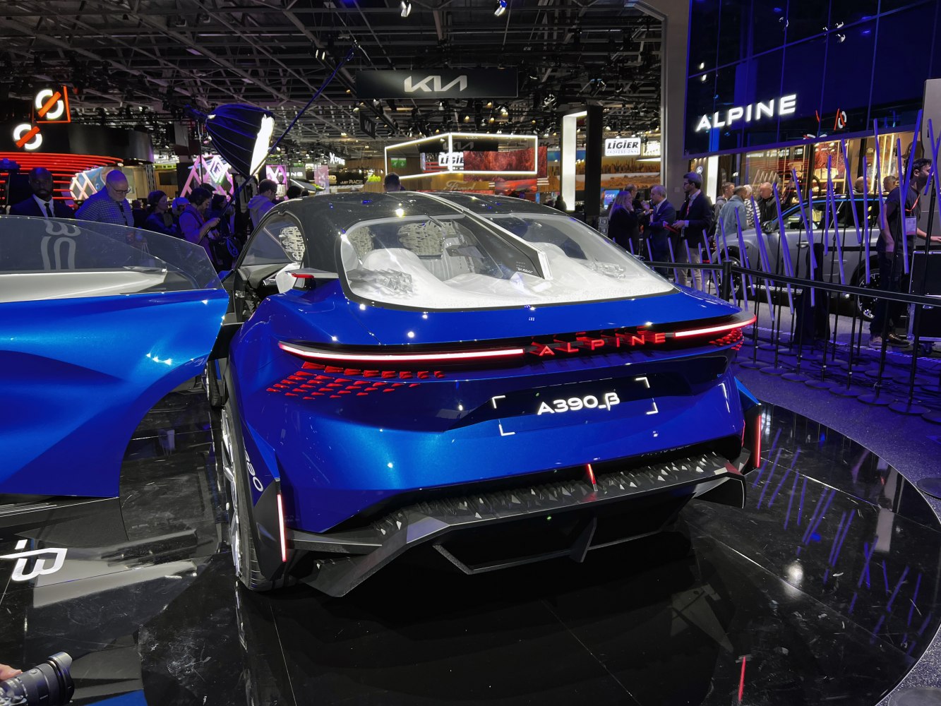 Futuristic rear design and advanced LED lighting of a blue sports concept.