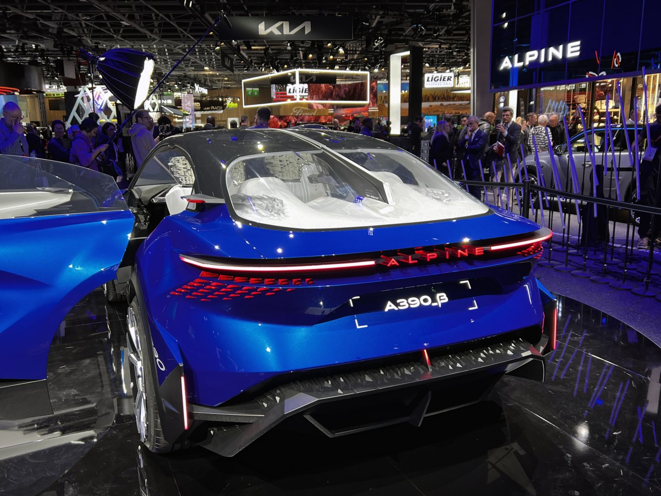 Rear design and futuristic LED lighting of a blue concept sports car.