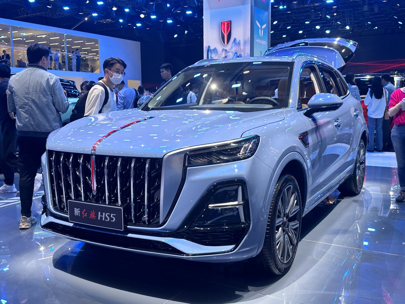 Large vertical grille and sharp LED headlights on a modern SUV.