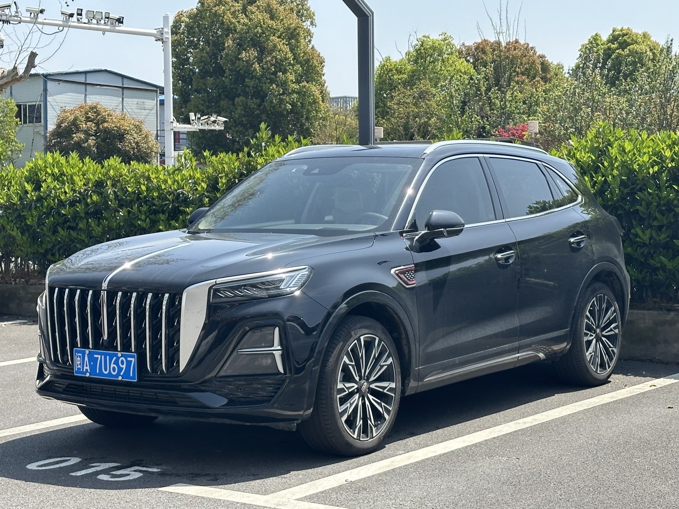 Luxury SUV with vertical grille, LED headlights, and alloy wheels