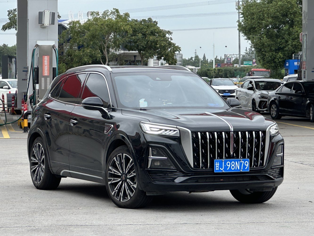 Bold vertical grille and sleek LED headlights on a modern SUV front.