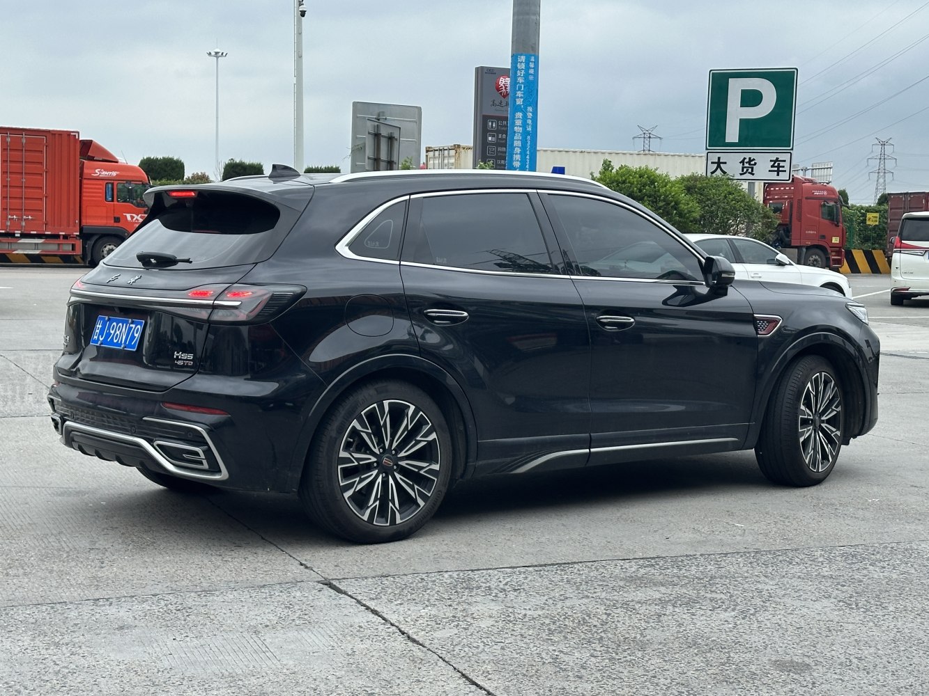 Rear view of luxury SUV with LED taillights and sporty alloy wheels