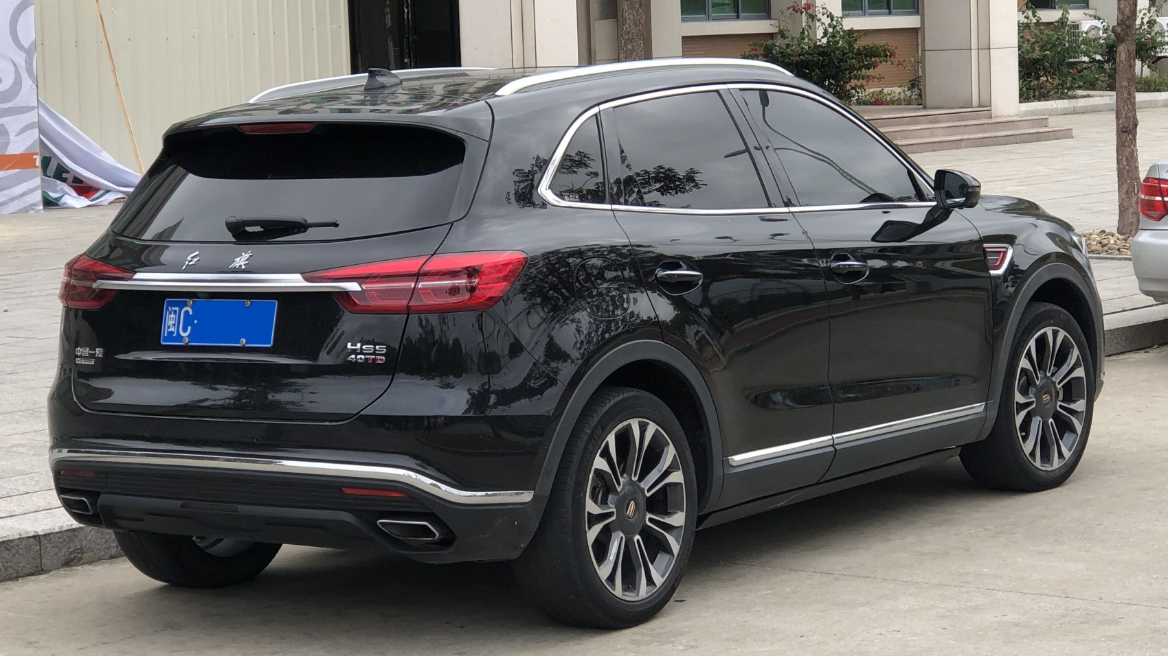 Sleek rear and side exterior with distinctive taillights and alloy wheels