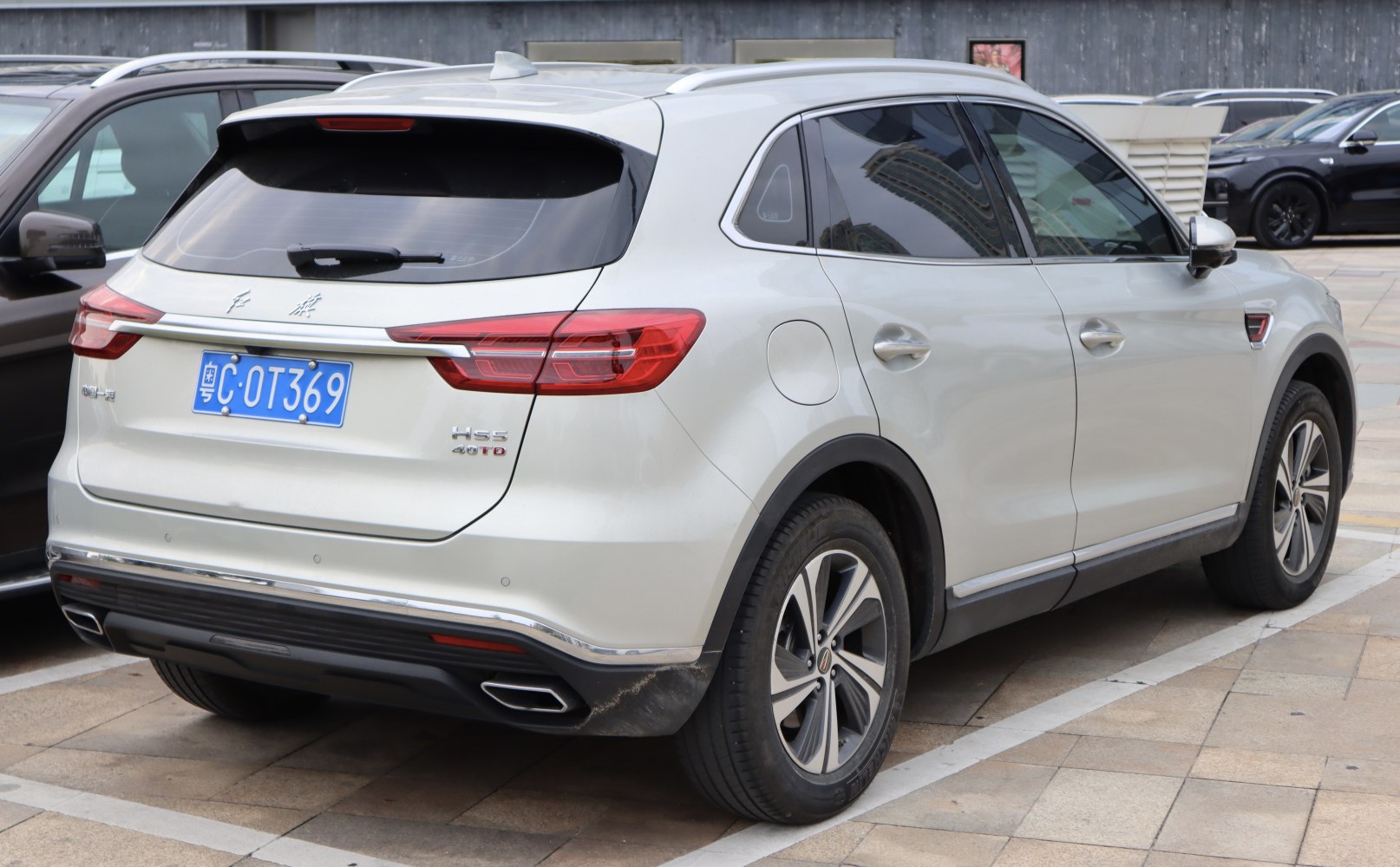 Rear view of white SUV with modern tail lights and 40T badge