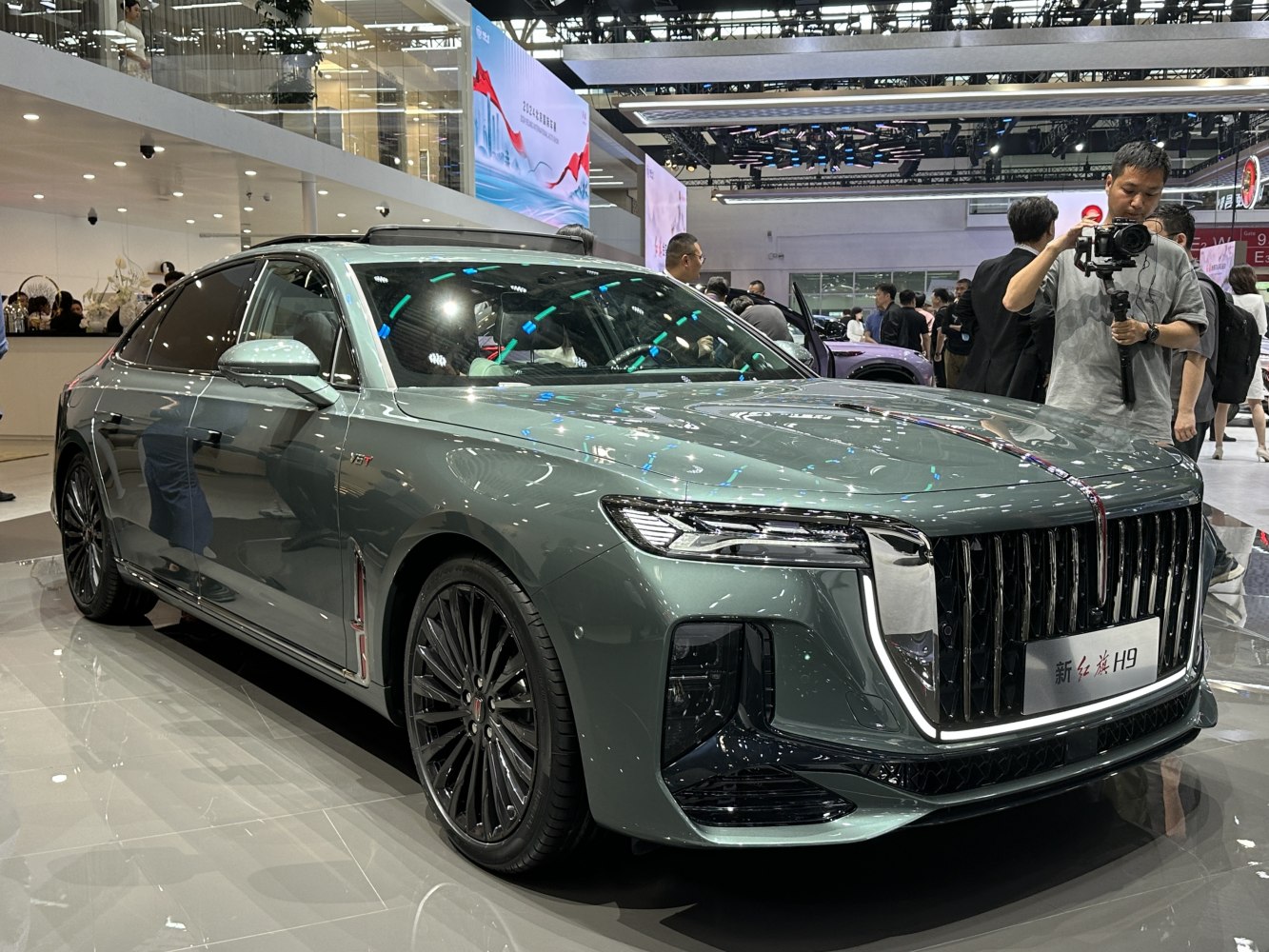 Luxury sedan with bold grille and sleek LED headlights