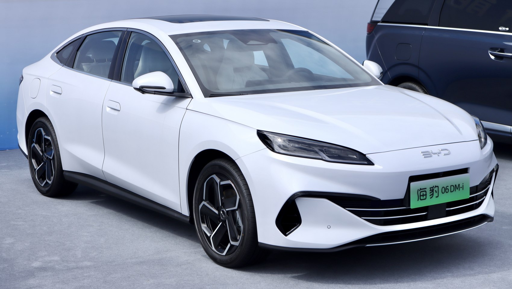 Sleek aerodynamic front with modern LED headlights and sporty wheels.