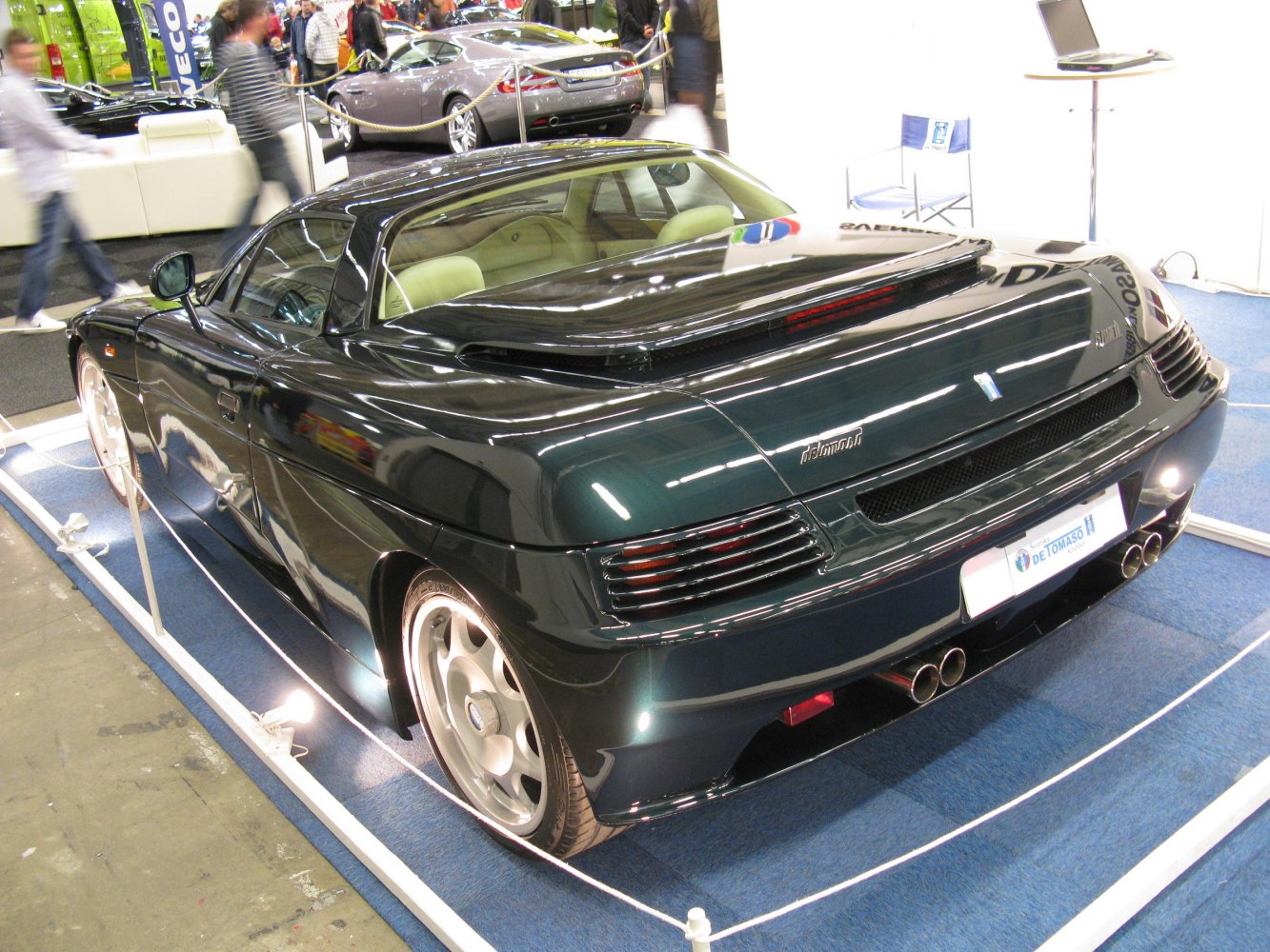 Rear view with quad exhaust and aerodynamic tail design