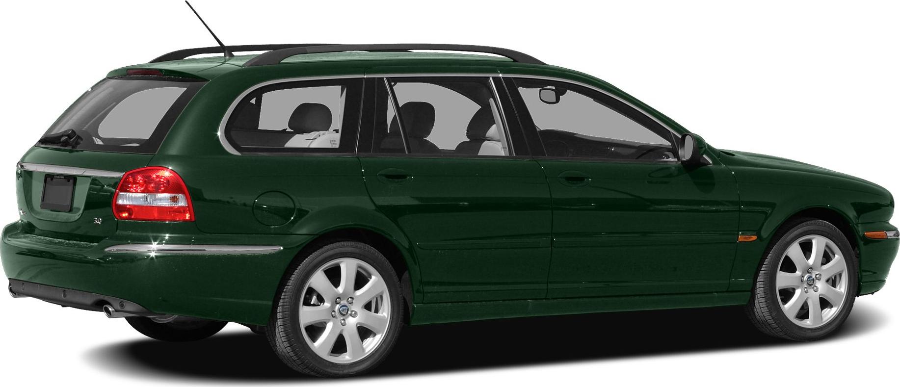 Rear-side view of a classic station wagon with roof rails and alloy wheels