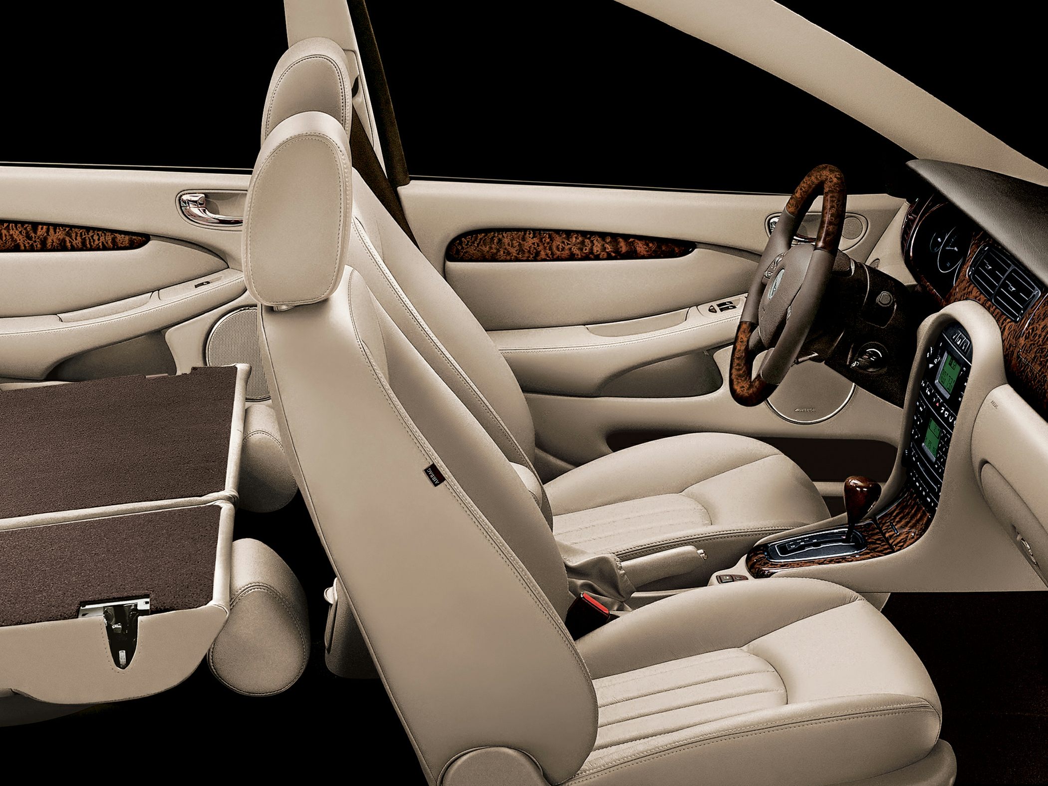 Beige leather seats and wood trim luxury car interior