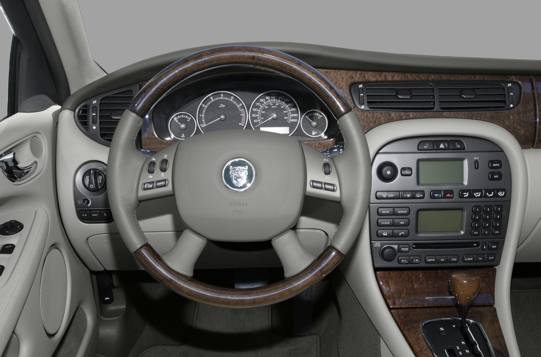 Wood-trimmed steering wheel and detailed dashboard controls