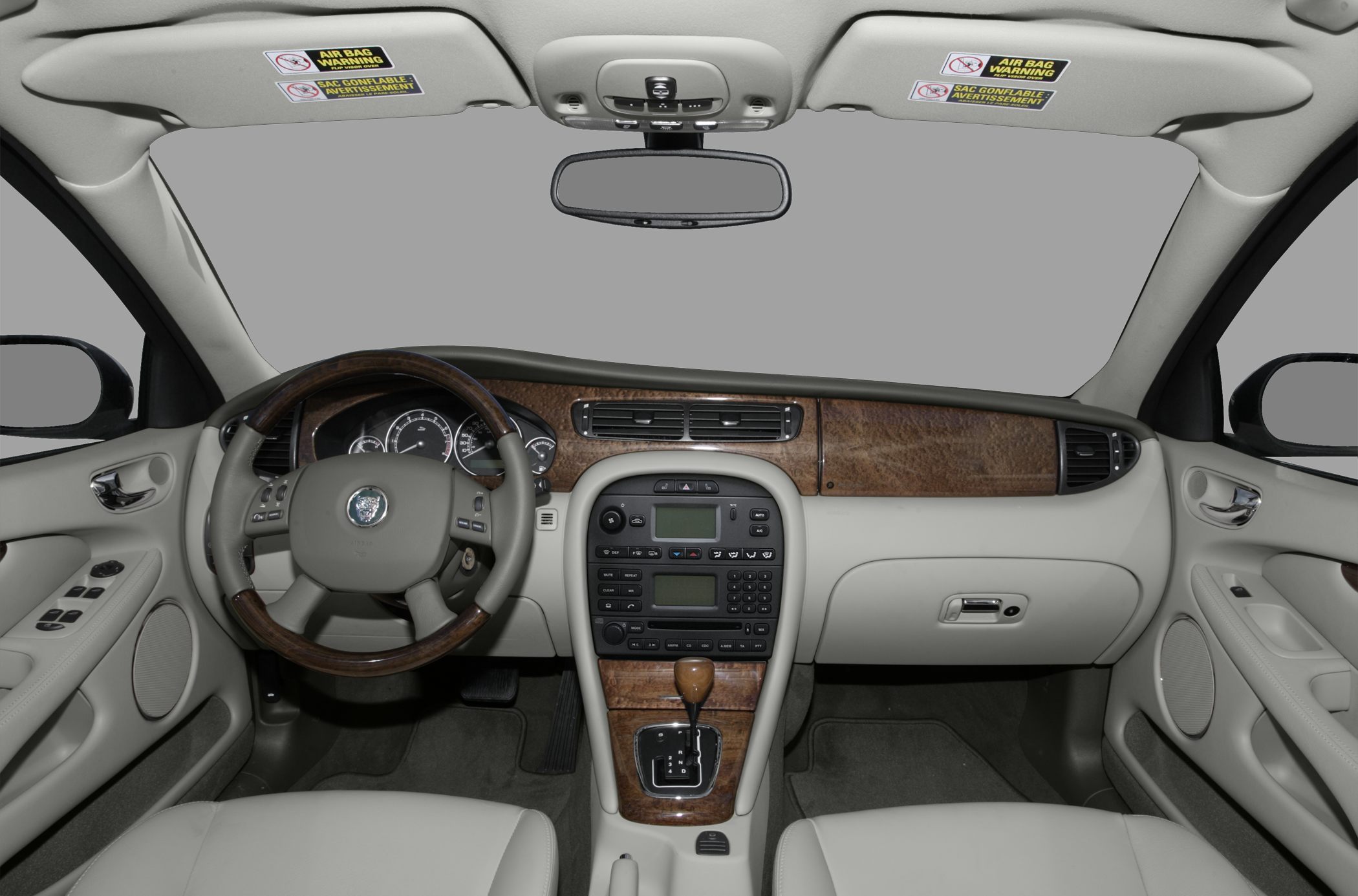Wood trim dashboard and multifunction leather steering wheel
