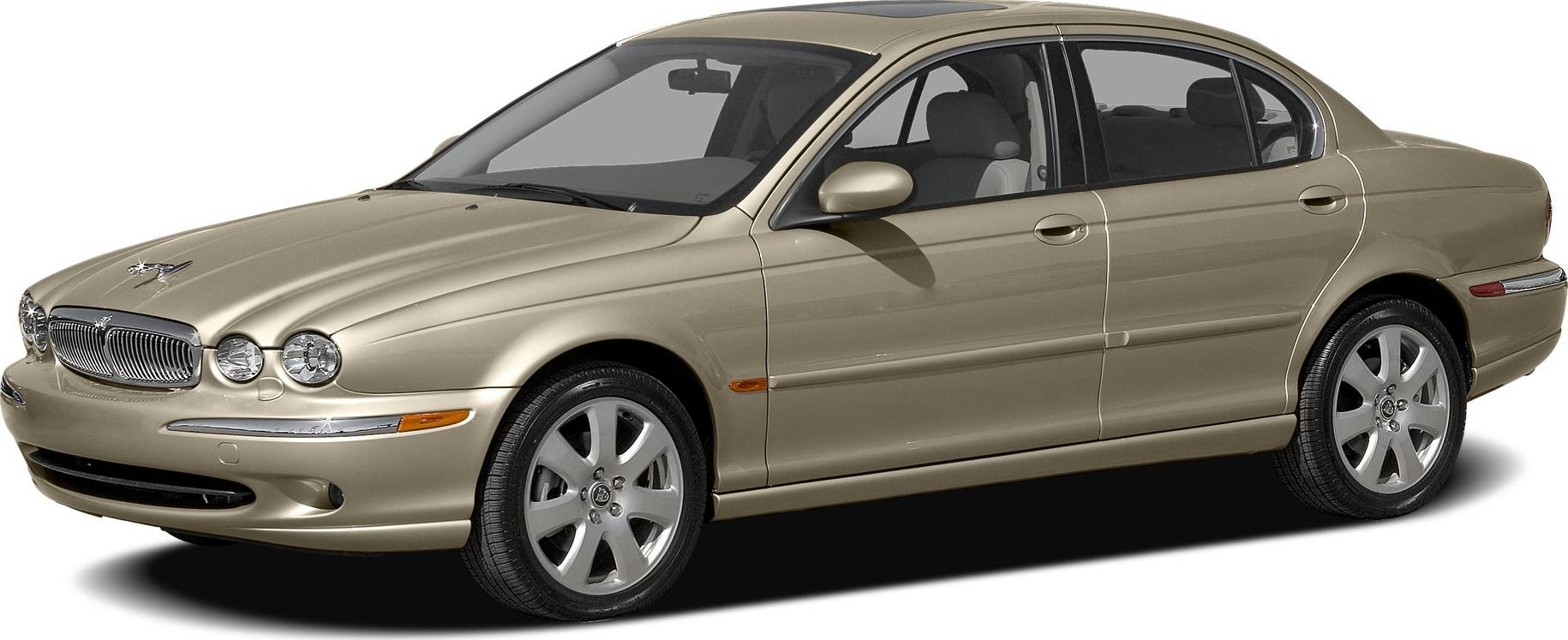 Classic sedan with rounded dual headlights and alloy wheels.