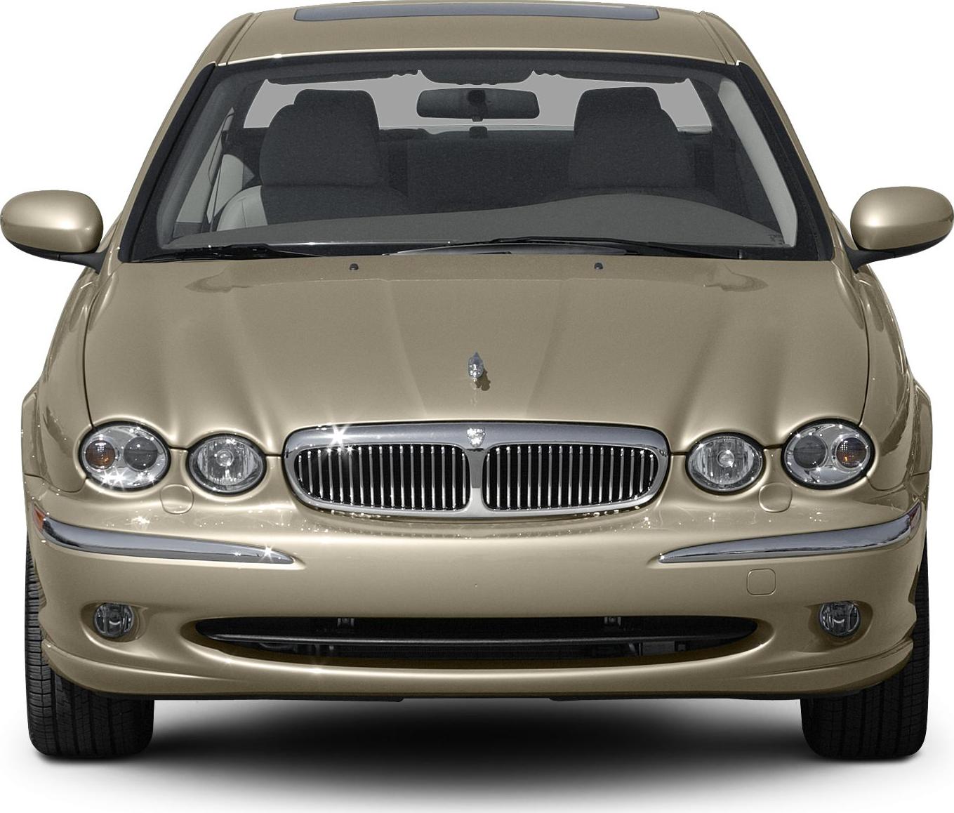 Front view with iconic grille and quad round headlights
