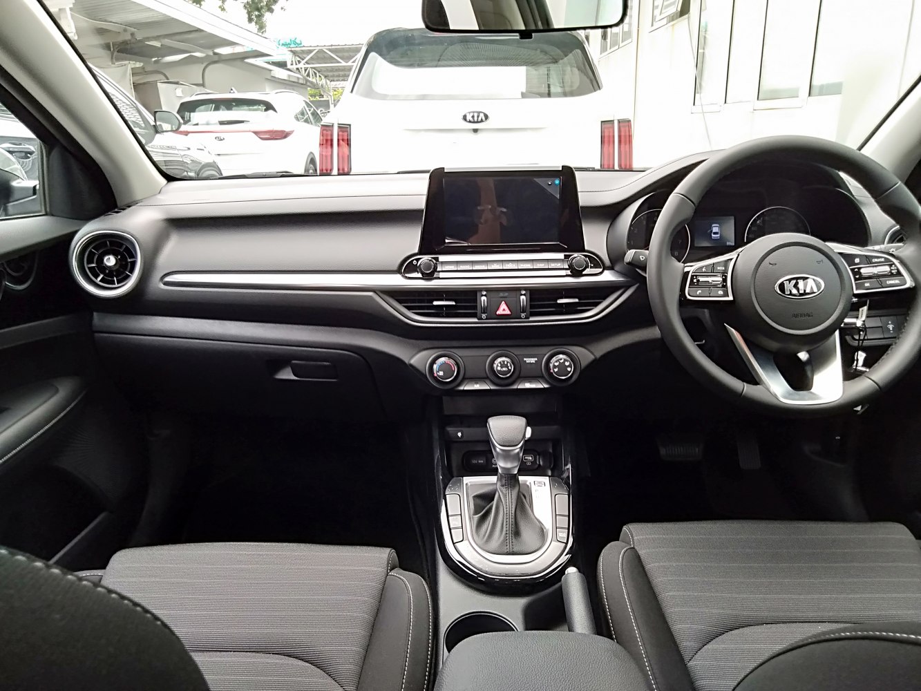 Dashboard and gear shift with steering wheel and controls