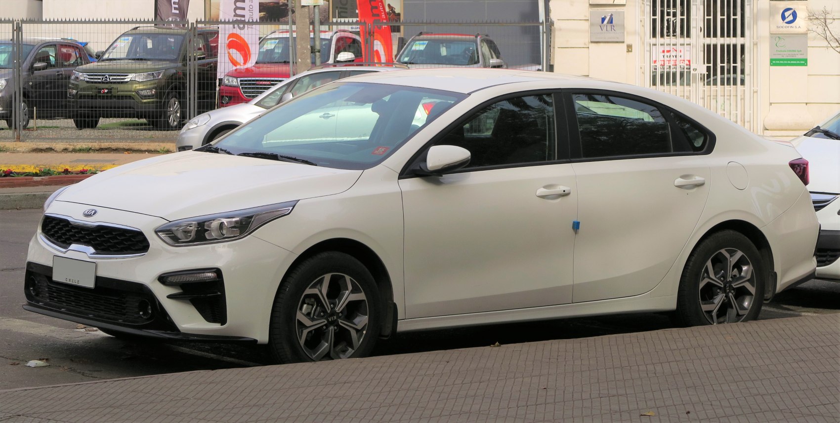 White sedan with modern alloy wheels and sharp headlights