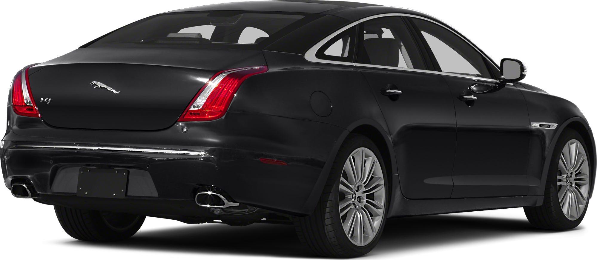 Rear and side view of luxury sedan with distinctive tail lights and chrome exhaust.