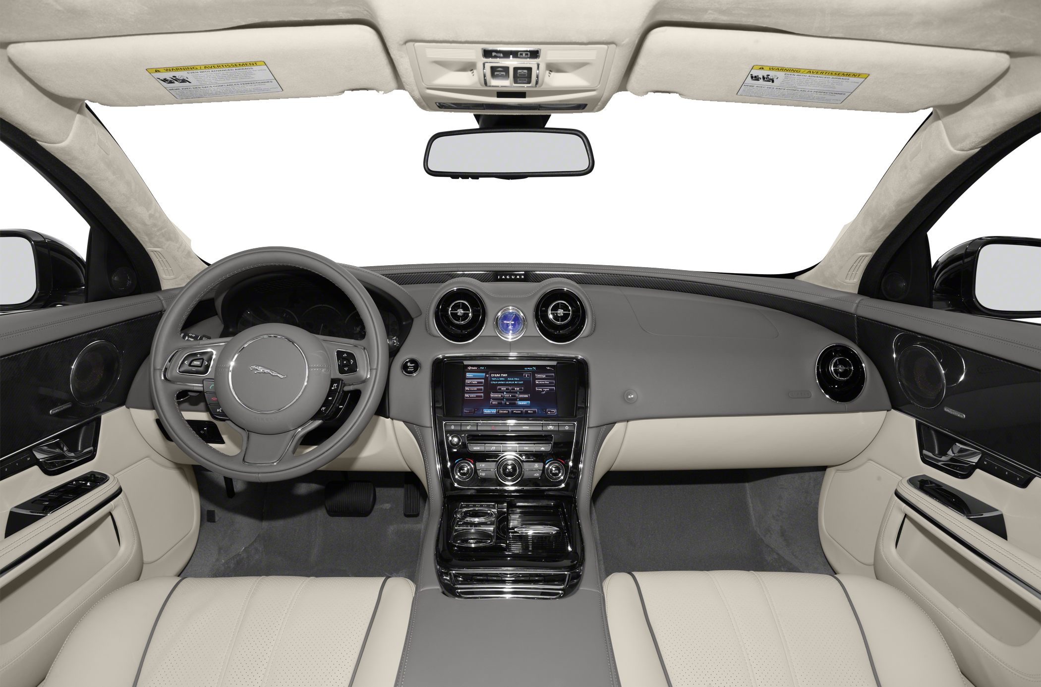 Luxury car interior with dashboard, steering wheel, and round air vents.