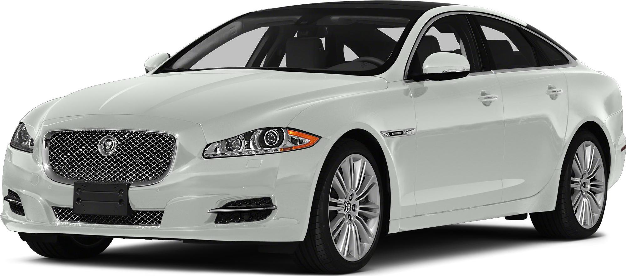 Luxury sedan front view showcasing mesh grille and alloy wheels
