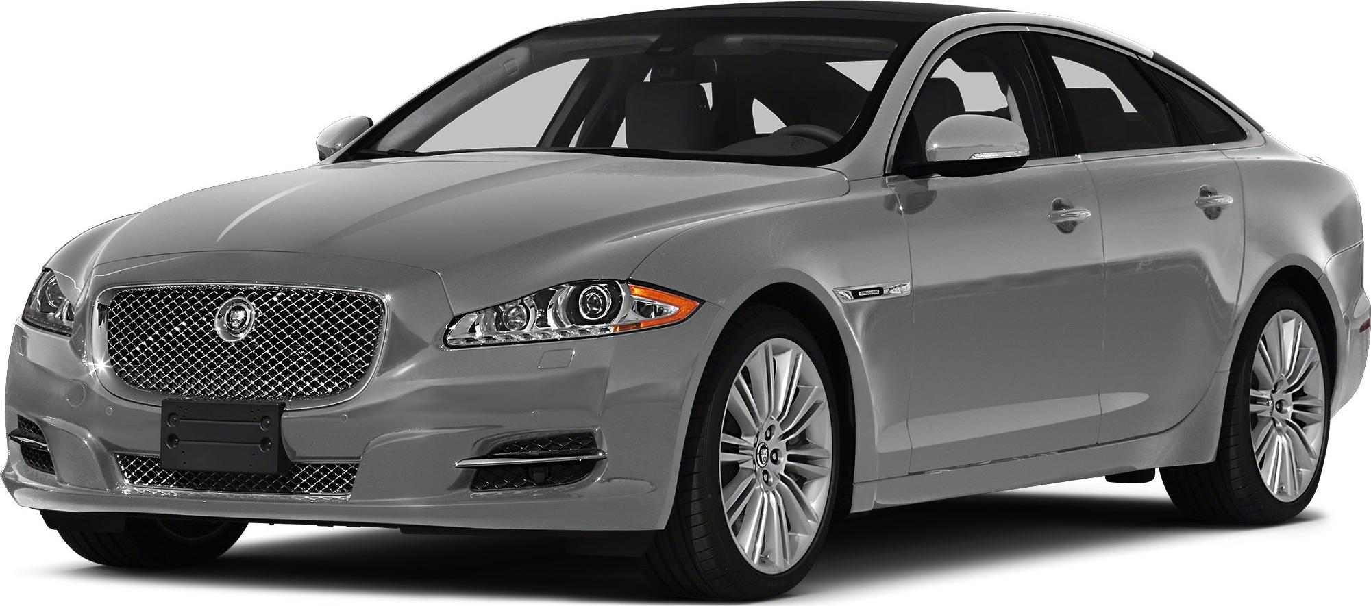 Luxury sedan front grille, headlights, and alloy wheels in close-up