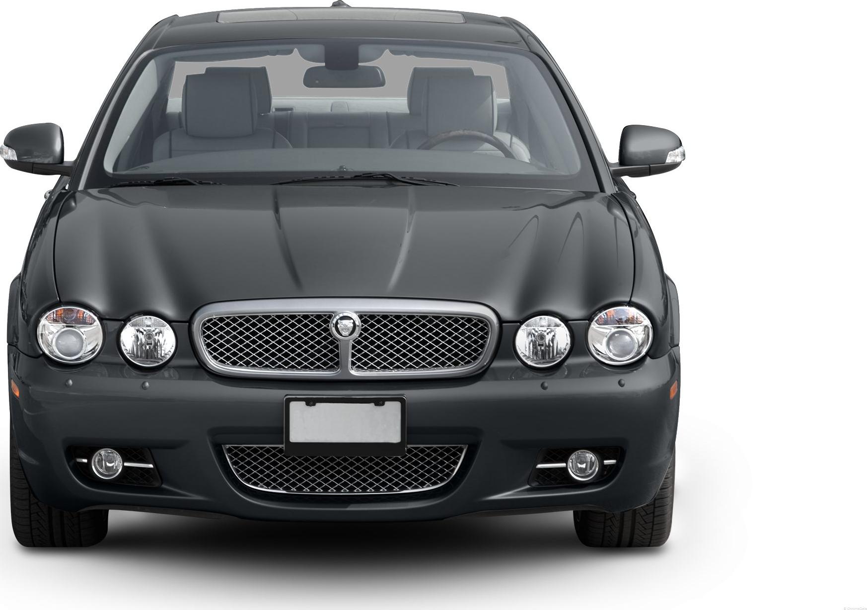 Front view with twin round headlights and mesh grille