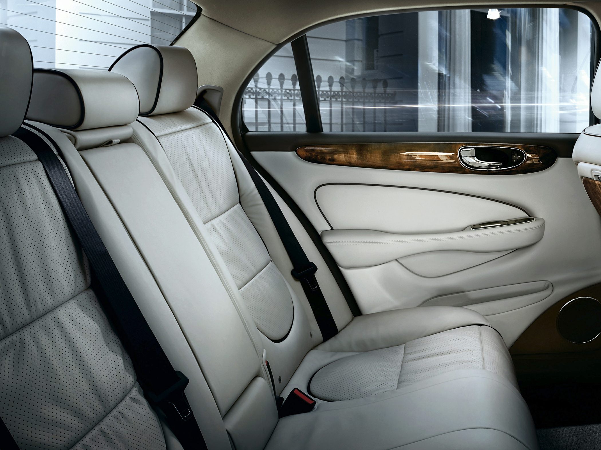 Perforated leather rear seats with wooden panel trim