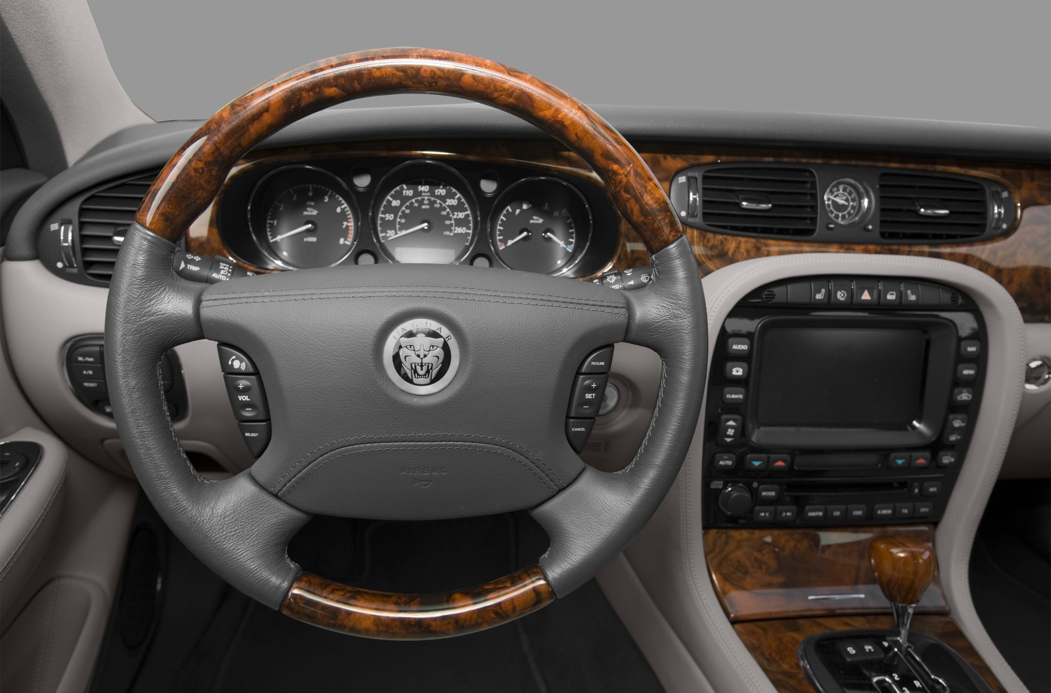 Wood-trimmed steering wheel and detailed dashboard controls