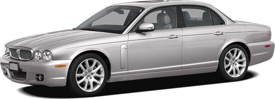 Silver luxury sedan with chrome handles and multi-spoke alloy wheels