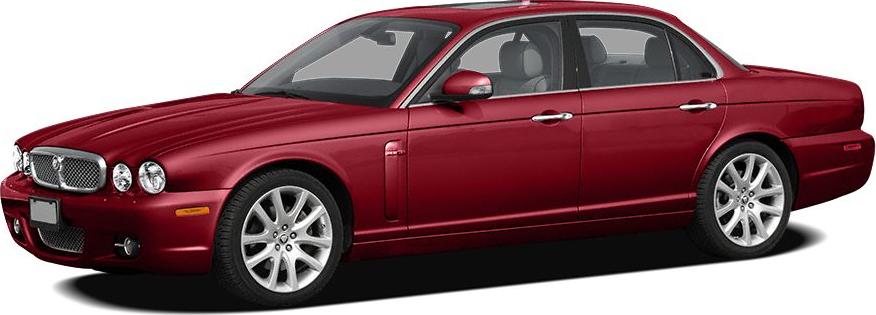 Red luxury sedan with classic front grille and elegant long body.