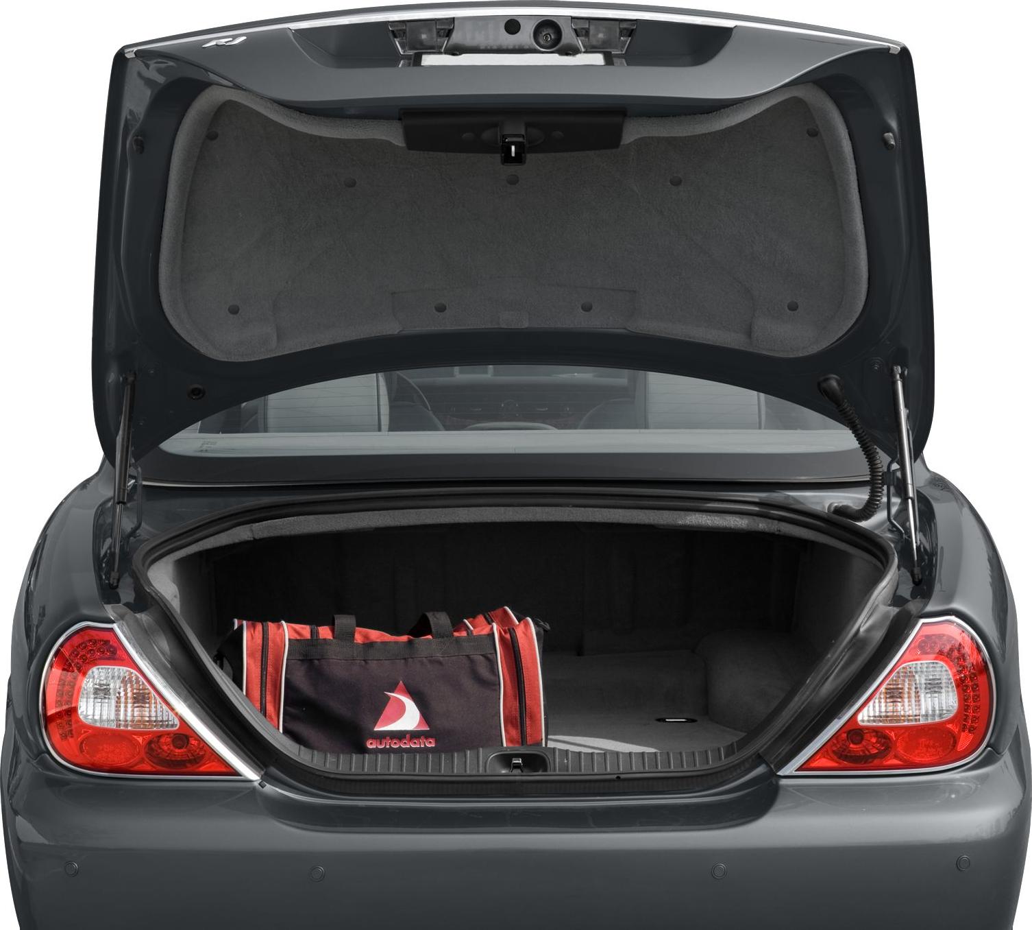 Open trunk and tailgate showing luggage bag inside spacious car rear storage