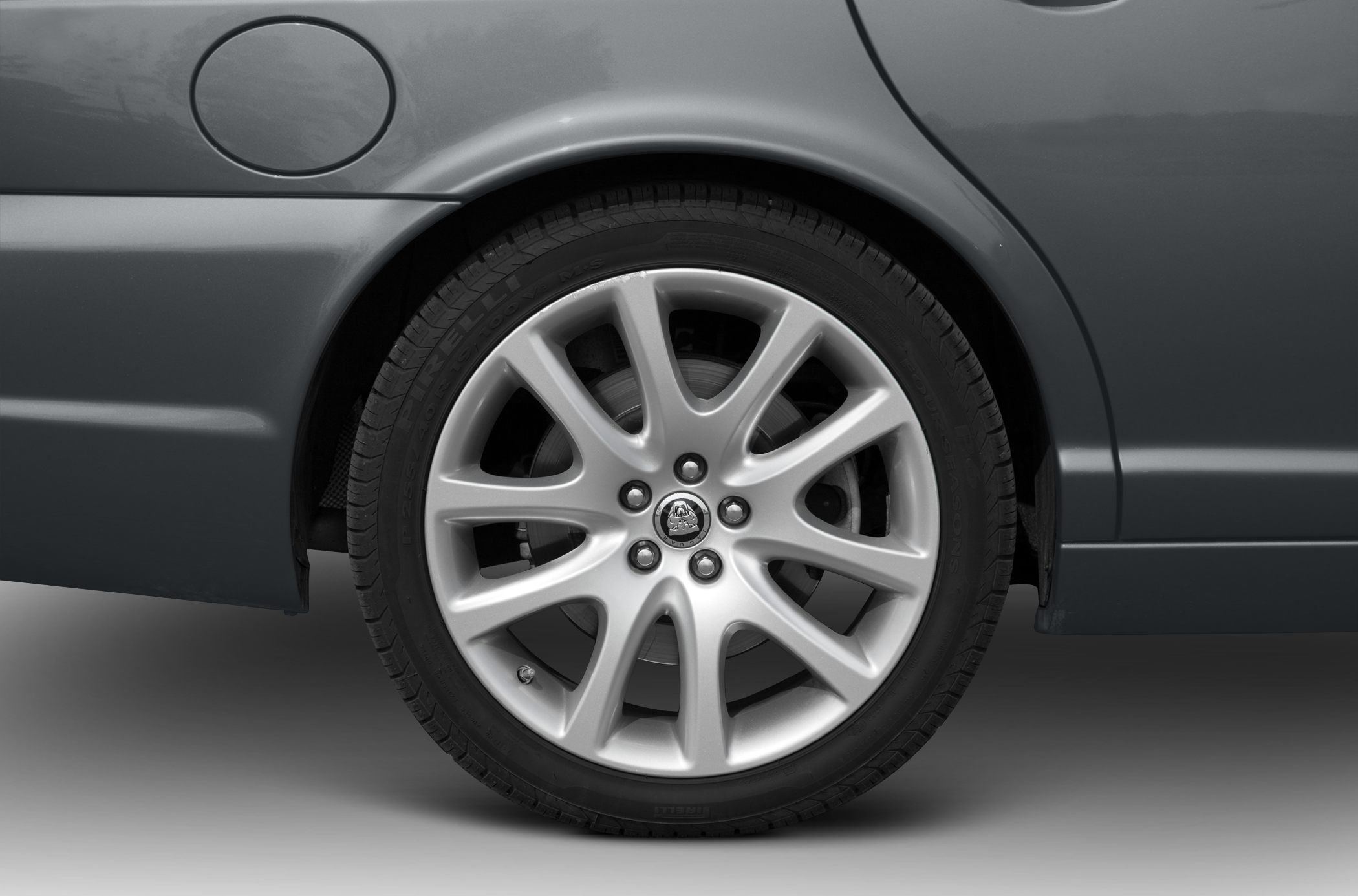 Silver alloy wheel and tire close-up
