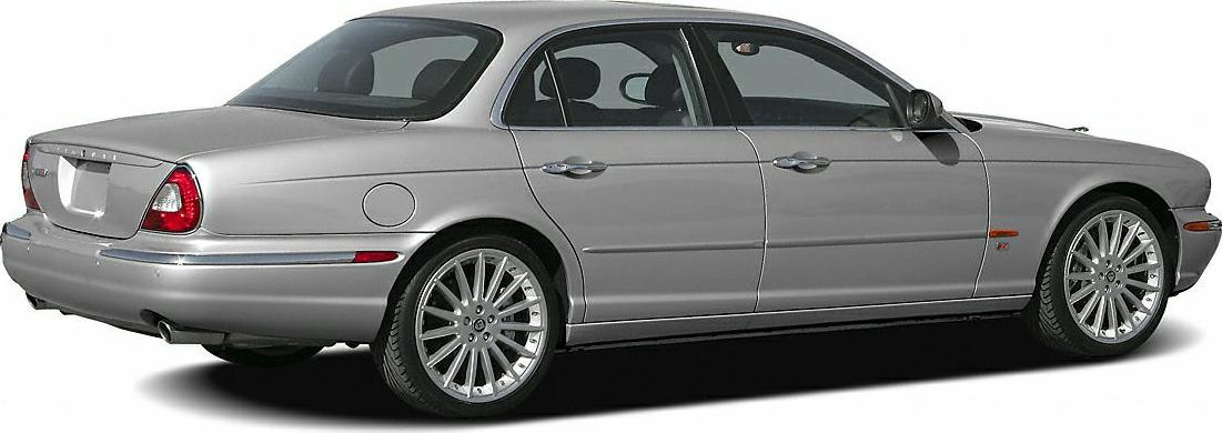 Silver luxury sedan with rear and side view, alloy wheels